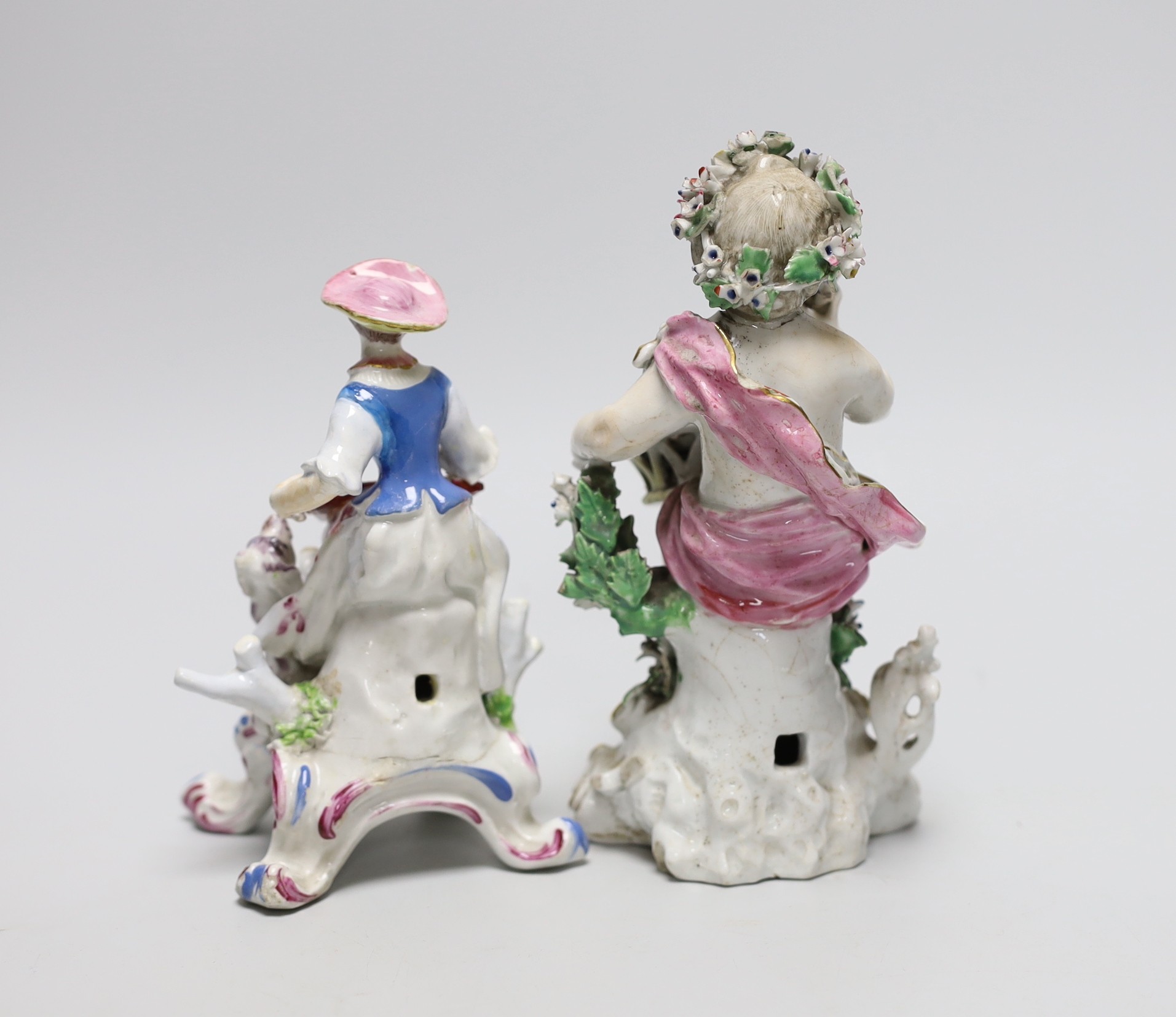 An 18th century Derby figure of a girl playing a musical instrument with a dog at her side and another of a putti flower girl, 17cm